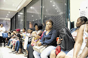 LOSING HOPE: Lerato Motloung, in the navy top, waits at the Gauteng education department to get her daughter placed in school