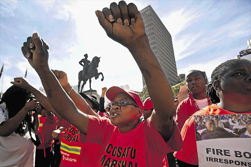 Hundreds of teachers protest in front of parliament in Cape Town yesterday to demand the removal of Basic Education Minister Angie Motshekga. Teachers in Gauteng marched to the Union Buildings to urge President Jacob Zuma to act within 21 days or face the ire of organised labour