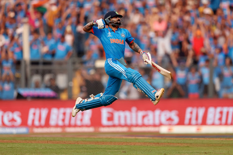 Virat Kohli of India celebrates his 50th ODI century, overtaking Sachin Tendulkar for the record, in the 2023 Cricket World Cup semifinal against New Zealand at Wankhede Stadium in Mumbai on Wednesday.