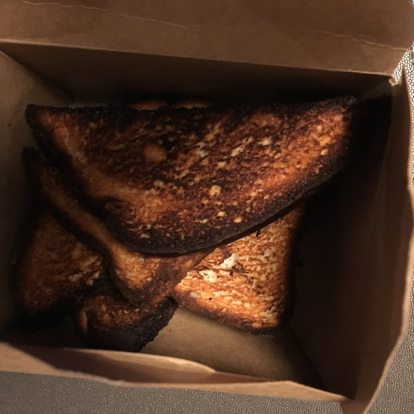 Burnt gf bread that went with artichoke dip