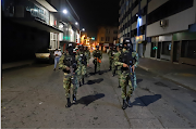 Members of security forces patrol in Cali as President Ivan Duque ordered 