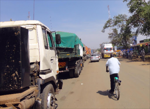 DELAYED: Trucks wait for checking and clearance at the Malaba border between Kenya and Uganda.Photo/Reuben Olita