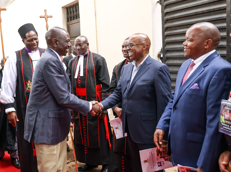 Businessman Jimi Wanjigi greeting President William Ruto after he arrived at ACK St James Cathedral in Kiambu town on August 17, 2023
