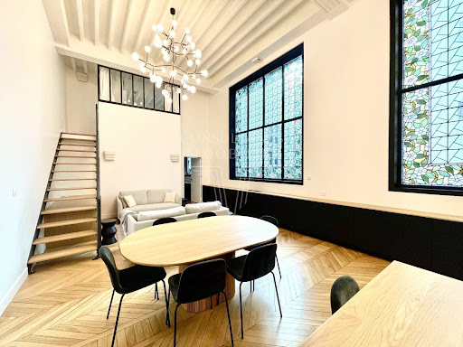 Dining room with tables and staircase - Property rental in Paris 6ème, 2 bedrooms
