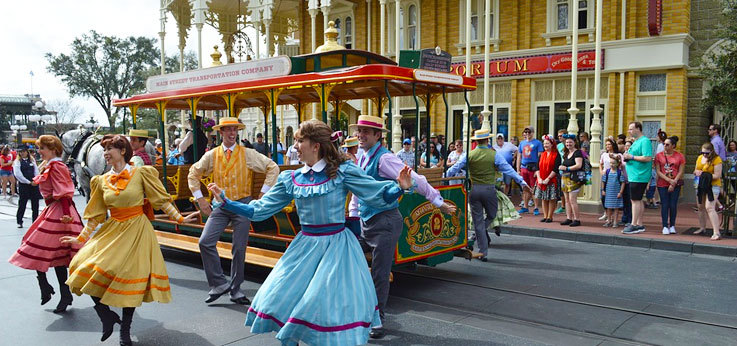 Transport and dancers on Main Street Magic Kingdom