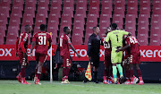 Chibuike Ohizu of Sekhukhune United celebrates a goal with teammates during the DStv Premiership match against  AmaZulu FC at Ellis Park Stadium on October 27 in Johannesburg.