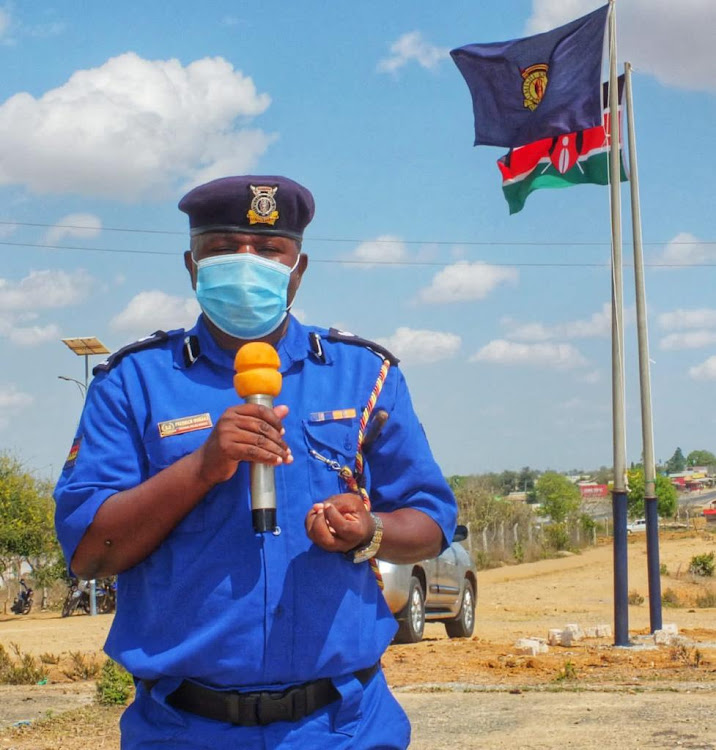 Kinango subcounty police commander Fredrick Ombaka speaks to Kwale residents during a security awareness meeting in January 2022