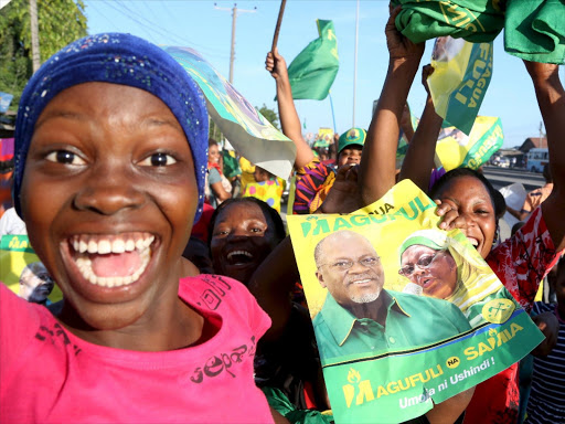 Supporters of Tanzania Presidential candidate of the ruling Chama Cha Mapinduzi (CCM) John Pombe Magufuli celebrate after he was declared the winner of the presidential election, in Dar es Salaam, October 29, 2015. /REUTERS