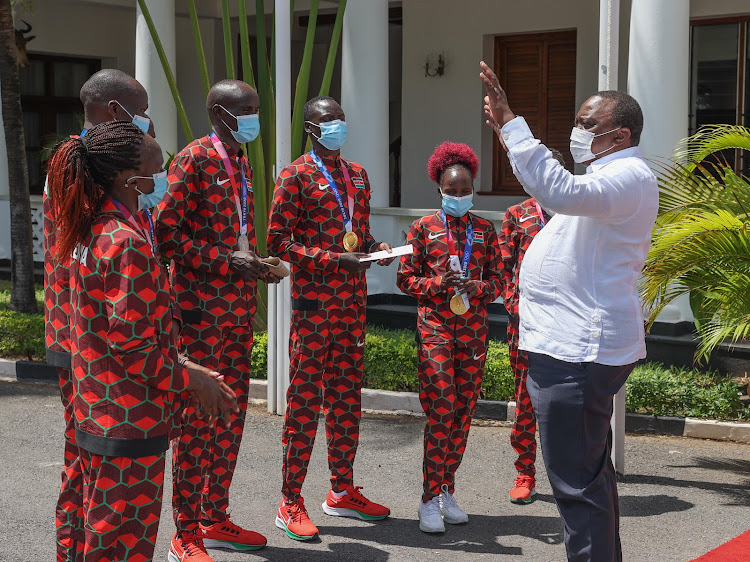 President Uhuru Kenyatta with Kenya's medalists from the 2020 Tokyo Olympics at State House, Mombasa.