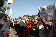 Demonstrators outside the ANC provincial office carrying placards in supports of eThekwini mayor Zandile Gumede. 