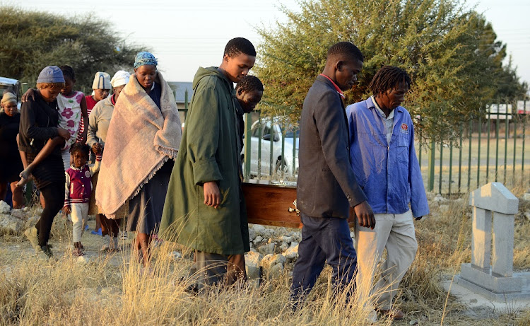 Pallbearers carrying a coffin of toddler Boitumelo Tshabalala(2) during the funeral service at Motlhabeng Village Cemetery.