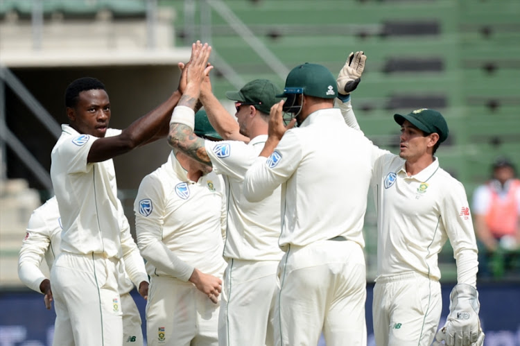 Kagiso Rabada (L) of South Africa celebrates the wicket with team mates during day 2 of the 2nd Castle Lager Test match between South Africa and Sri Lanka at St George's Park on February 22, 2019 in Port Elizabeth, South Africa.