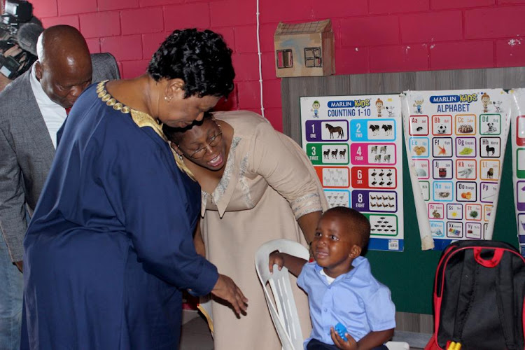 Basic education minister Angie Motshekga soothes five-year-old Hlelokuhle Ndaba at Kwa-Zubumnandi pre-school in Umlazi on Wednesday.