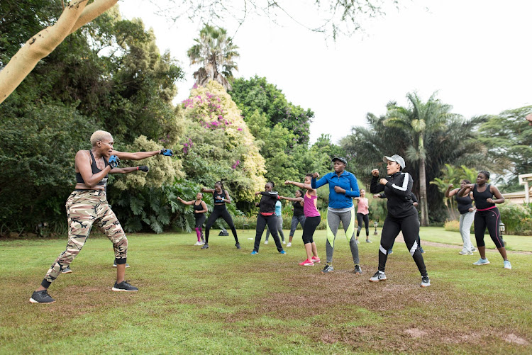 Body combat team takes the women through les mills