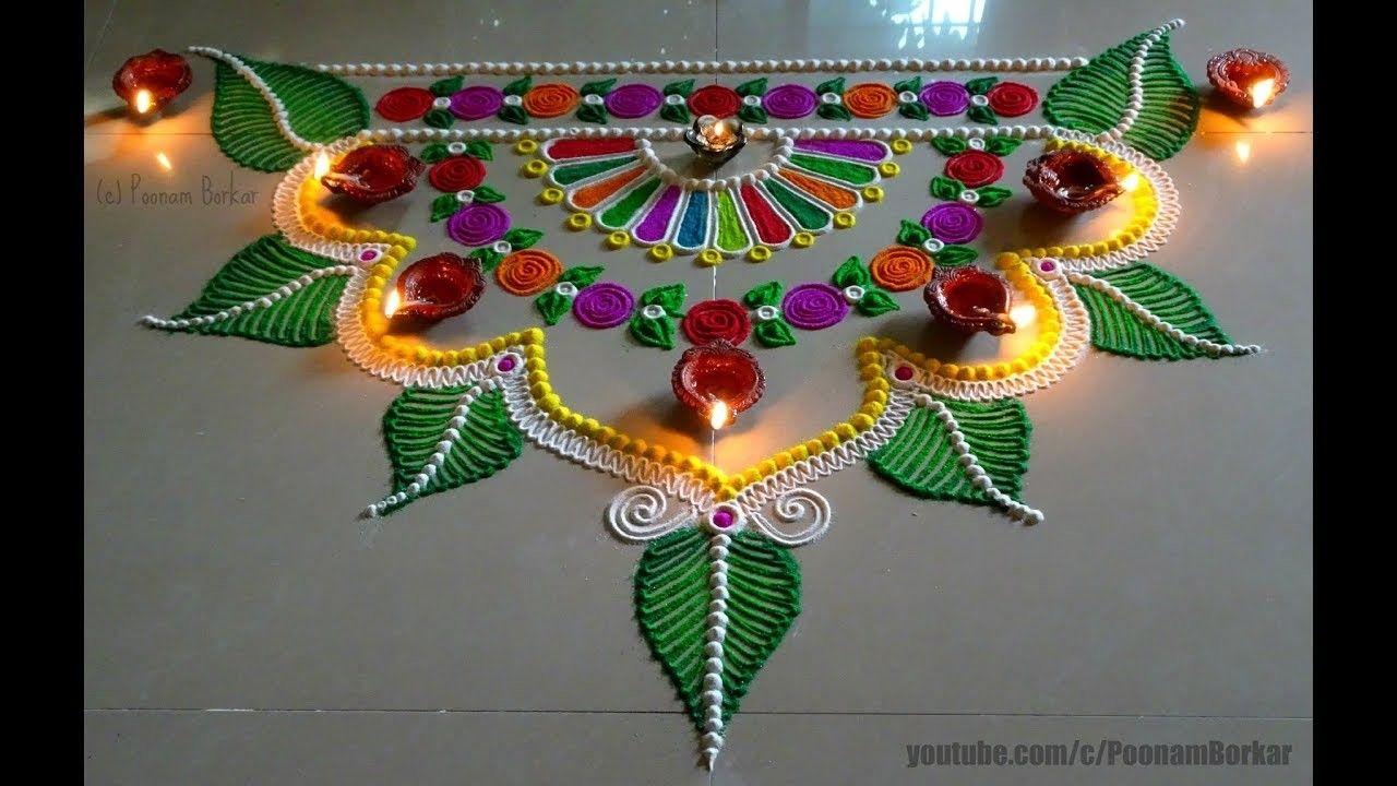 SEMI-CIRCULAR MANDALA WITH POWDERED COLORS RANGOLI