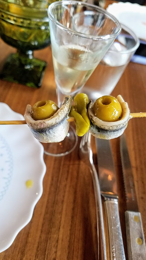 Pinxtos during Pinxto Hour at Urdaneta: here you see fried chickepas and also the traditional Gilda with house boquerones, Basque piparra pepper, anchovy stuffed olive