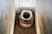 The child, allegedly lowered into the pit toilet to find the principal's cellphone, was mocked by pupils and is traumatised. File photo. 