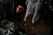 Rescue workers are seen in Tham Luang caves during a search for 12 members of an under-16 soccer team and their coach, in the northern province of Chiang Rai, Thailand, June 27, 2018. 