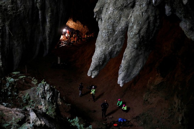 Rescue workers are seen in Tham Luang caves during a search for 12 members of an under-16 soccer team and their coach, in the northern province of Chiang Rai, Thailand, June 27, 2018.