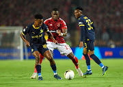 Themba Zwane of Mamelodi Sundowns is challenged by Aliou Dieng of Al Ahly in their 2023 African Football League match at Cairo International Stadium in Egypt on Wednesday night.