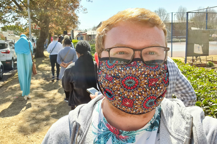 Social and environmental campaigner Ulrich Janse van Vuuren waits in the queue at the Parkhurst Recreation Centre to be vaccinated. He urged his 1-million Twitter followers to join him in participating in the rollout.