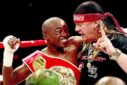 Moruti Mthalane celebrates with Nick Durandt after winning the IBF title against Zolani Tete in 2010.  /  Antonio Muchave