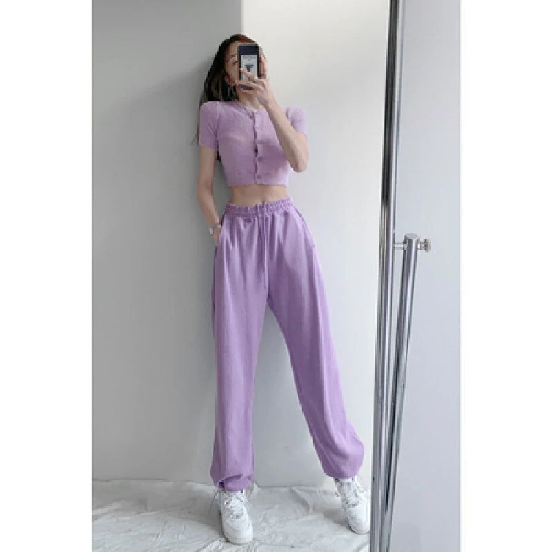 Dames losse casual legging met hoge taille en trekkoord, voor een comfortabele en flatterende look, ideaal voor dagelijks gebruik en vrijetijdsactiviteiten.