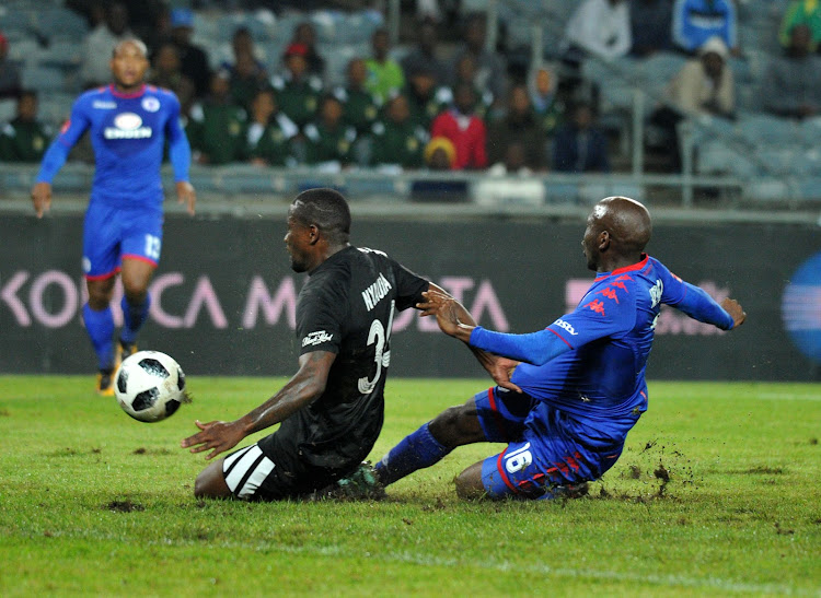 Ntsikelelo Nyauza of Orlando Pirates challenged by Aubrey Modiba of Supersport United during Absa Premiership 2017/18 match between Orlando Pirates and Supersport United at Orlando Stadium Johannesburg South Africa on 05 December 2017.