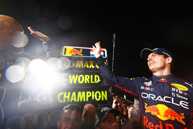 2022 F1 World Drivers Champion Max Verstappen celebrates with his team after the F1 Grand Prix of Japan at Suzuka International Racing Course on October 9 2022 in Suzuka, Japan.