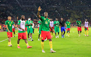 Cameroon players applaud the fans at the Olembe Stadium in Yaounde. 