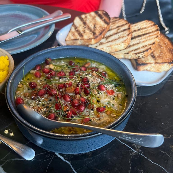 Baba ghanoush with gluten free bread grilled in a designated area