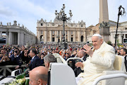 Pope Francis gestures as he attends the Palm Sunday Mass in Saint Peter's Square at the Vatican.
