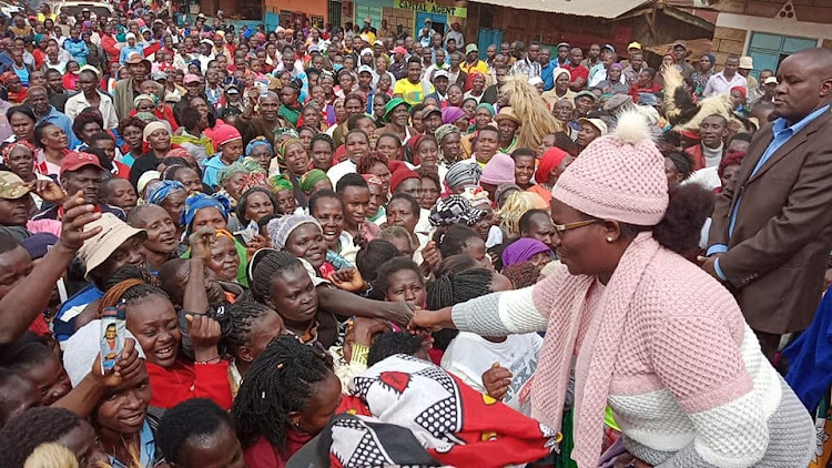 Meru Woman Representative Kawira Mwangaza and her deputy greet resident of Kithurine in South Imenti, Meru on Monday, June 27.