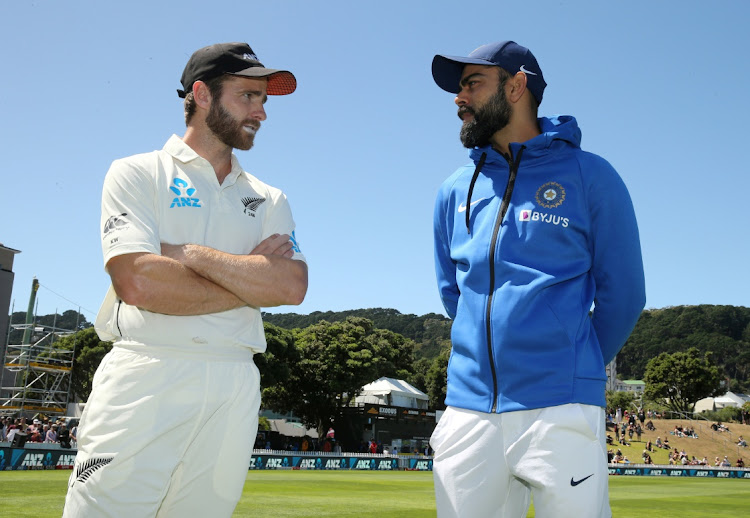 New Zealand's Kane Williamson talks to India's Virat Kohli in this file picture at Basin Reserve, Wellington, New Zealand, February 24, 2020