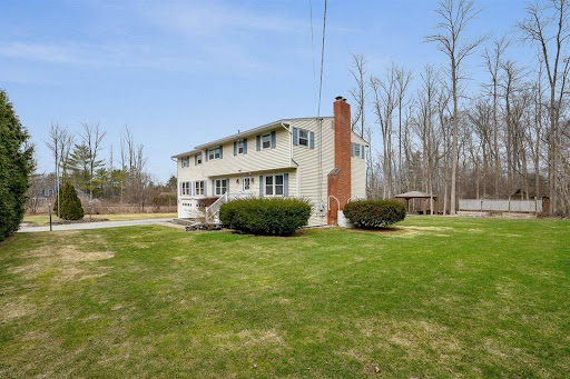 House with chimney and spacious garden in this luxury house for sale in Shelburne ($599,999)