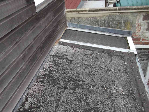 Complete replacement of flat roof including two roof lights, insulation, gutters etc.