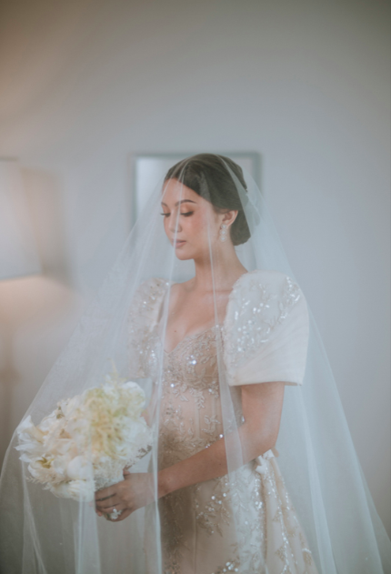 Filipina bride wearing a modern Filipiniana wedding dress.