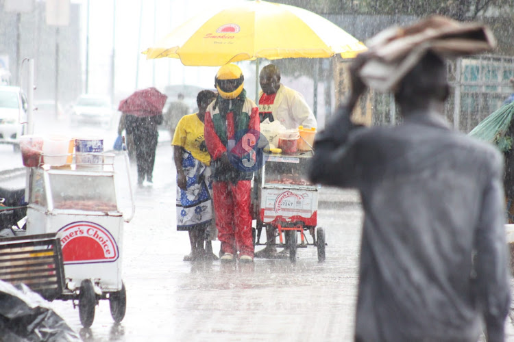 Traders brave heavy rains.