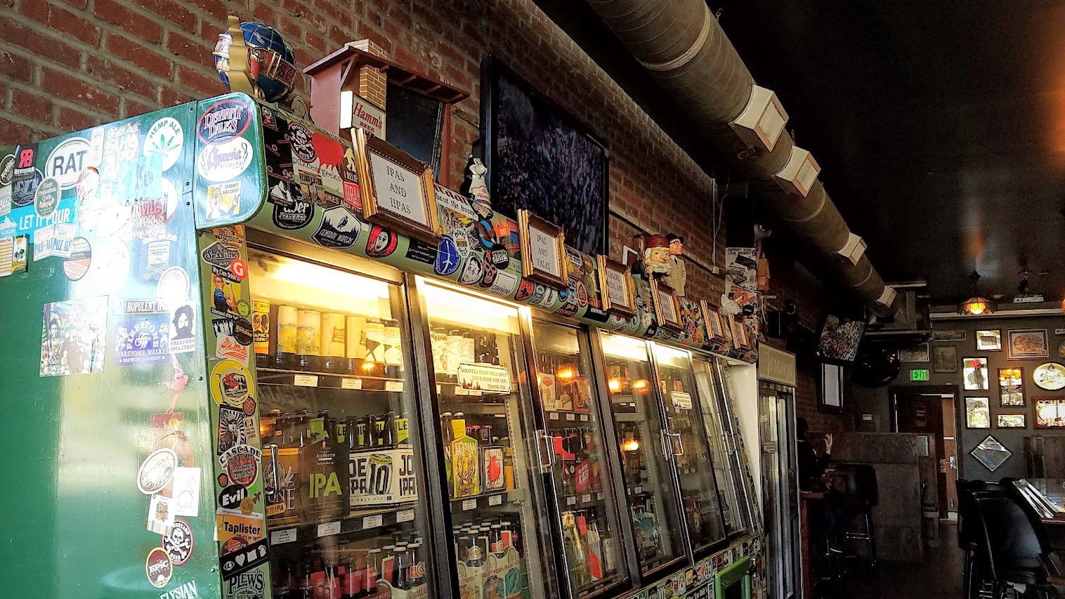 When you walk through that door of Saraveza, you immediately feel a bit like you're in a beer museum with all the retro beer paraphernalia all along the walls and the brightly lit coolers of their literally hundreds of beer by the bottle in addition to their 10 rotating taps