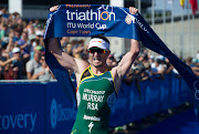 Richard Murray of South Africa celebrates his win in the 2017 Discovery Triathlon World Cup in Green Point, Cape Town on 11 February 2017.