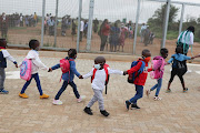 Grade R learners make their way into class for the first time on January 12 2022 at Setlabotjha Primary School in Sebokeng, southern Gauteng, during the first day of the academic year.