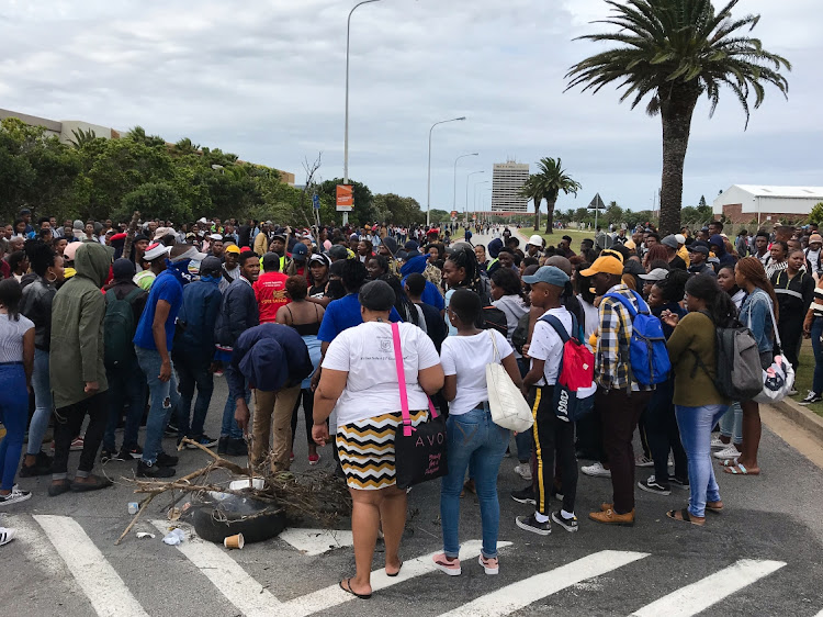 Students blocked roads leading to NMU North and South Campus during a protest on Monday. They were demanding among other things, the clearance for registration, acknowledgment of debt form, accepted for concession, NSFAS funding appeal process to fast-track the process, debt clearance, and accommodation.