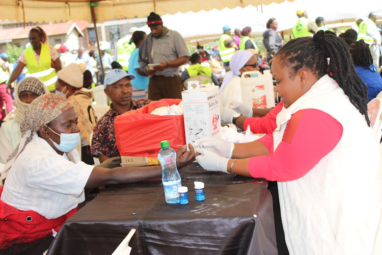 Patients during the medical camp in Kigumo on Saturday