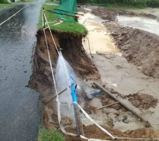 Part of a road in Queensburgh, outside Durban, caved in after heavy downpours on Wednesday.