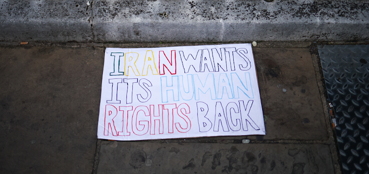 A placard is pictured during a protest against the Iranian regime, following the death of Mahsa Amini, outside Iran's consulate, in London, Britain, on October 9, 2022.