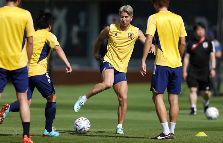 Takuma Asano of Japan on the ball during the training session at Al Sadd SC New Training Facilities on November 26, 2022 in Doha, Qatar.