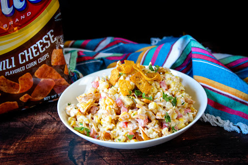 A large bowl of Frito Corn Salad.