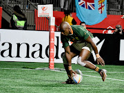 Siviwe Soyizwapi scores a try against Japan on day one of the HSBC Canada Sevens at BC Place in Vancouver on March 3 2023.