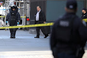 A member of the New York Police Department bomb squad is pictured outside the Time Warner Center in the Manhattan borough of New York City after a suspicious package was found inside the CNN Headquarters in New York, US, on October 24 2018. 