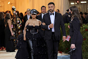 Nicki Minaj arrives on the carpet with designer Ricardo Tisci.